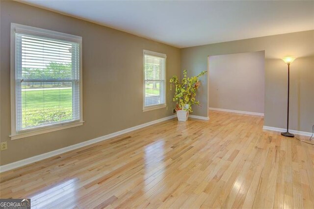 2808 Peeler Rd, Dunwoody, GA 30360 - spare room with light wood-type flooring and baseboards