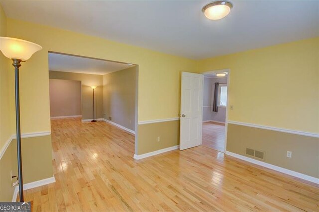 2808 Peeler Rd, Dunwoody, GA 30360 - empty room featuring wood finished floors and baseboards
