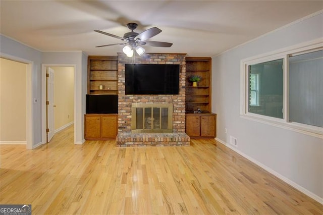 2808 Peeler Rd, Dunwoody, GA 30360 - unfurnished living room with ceiling fan, built in features, ornamental molding, wood finished floors, and baseboards