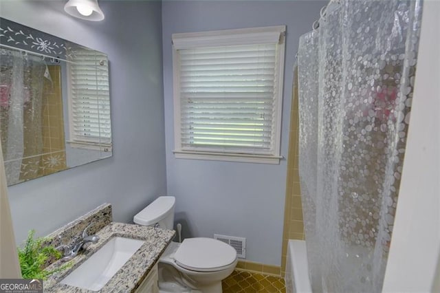2808 Peeler Rd, Dunwoody, GA 30360 - full bath featuring toilet, vanity, and shower / bath combo