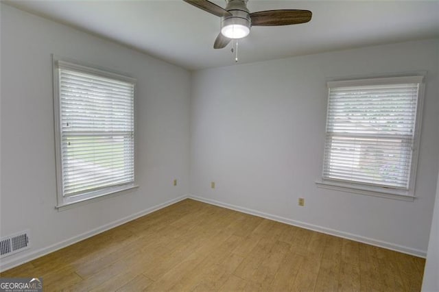 2808 Peeler Rd, Dunwoody, GA 30360 - unfurnished room featuring light wood-style flooring, a ceiling fan, and baseboards
