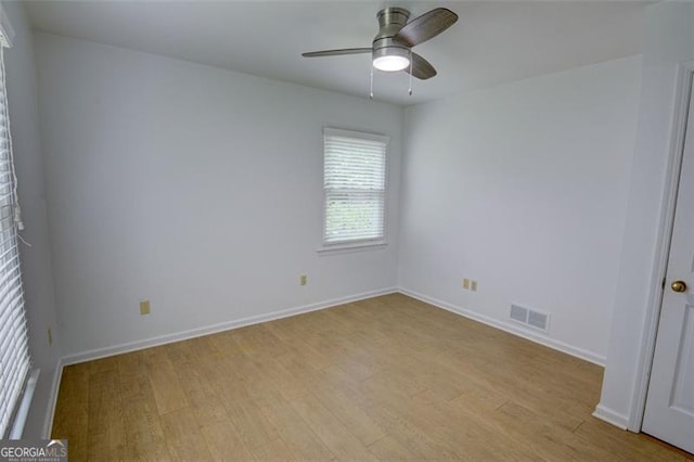 2808 Peeler Rd, Dunwoody, GA 30360 - unfurnished room featuring light wood-style floors, a ceiling fan, and baseboards