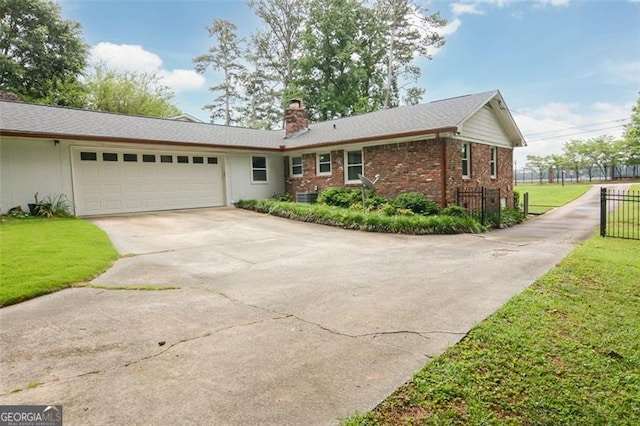 2808 Peeler Rd, Dunwoody, GA 30360 - ranch-style home featuring concrete driveway, a garage, a chimney, and brick siding