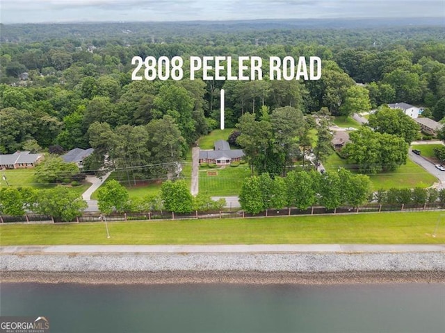 2808 Peeler Rd, Dunwoody, GA 30360 - aerial view of a large body of water and a forest