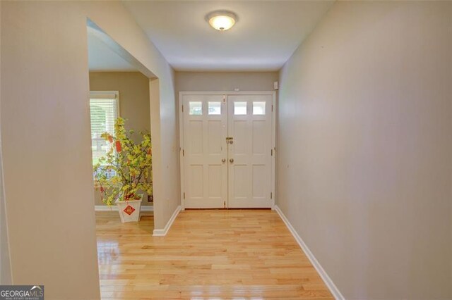 2808 Peeler Rd, Dunwoody, GA 30360 - entrance foyer with light wood finished floors and baseboards