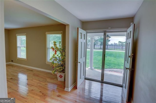 2808 Peeler Rd, Dunwoody, GA 30360 - doorway featuring light wood-type flooring and baseboards