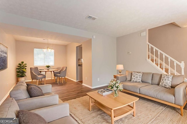 5092 Stone Trce, Stone Mountain, GA 30083 - living area with a chandelier, wood finished floors, baseboards, and stairs