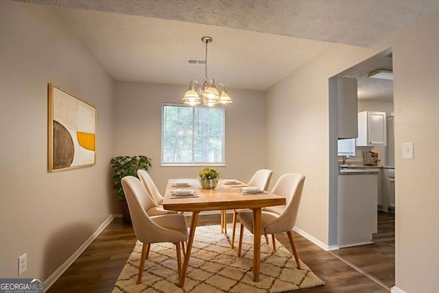 5092 Stone Trce, Stone Mountain, GA 30083 - dining space featuring baseboards, dark wood-style flooring, and a chandelier