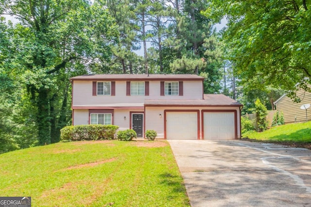 5092 Stone Trce, Stone Mountain, GA 30083 - view of front of property featuring driveway, a front lawn, and an attached garage