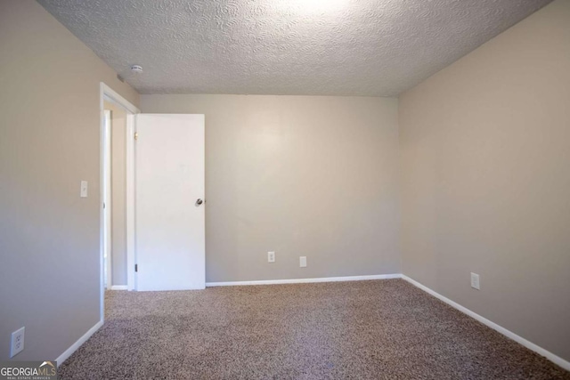 5092 Stone Trce, Stone Mountain, GA 30083 - empty room featuring a textured ceiling, carpet flooring, and baseboards