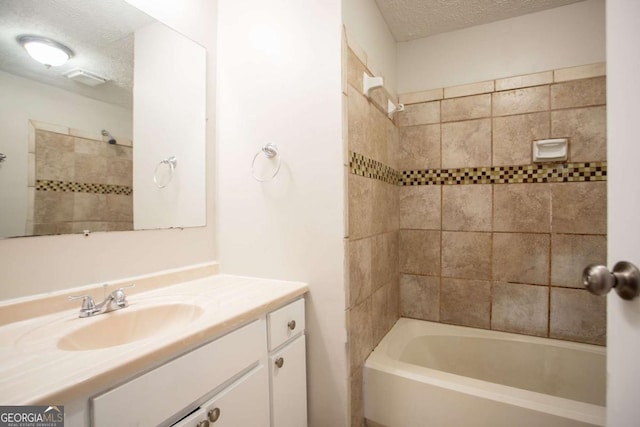 5092 Stone Trce, Stone Mountain, GA 30083 - full bath featuring a textured ceiling, vanity, and tub / shower combination