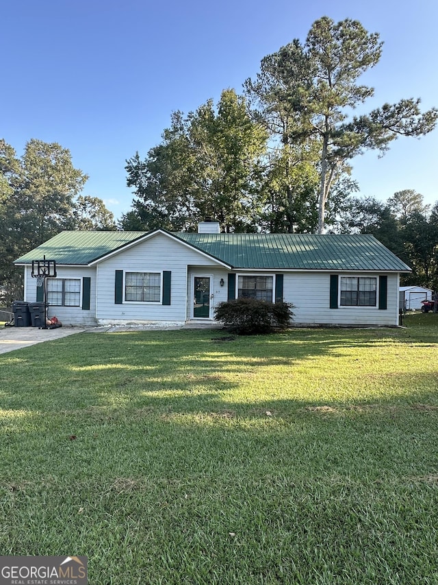 517 Pebble Pt, Loganville, GA 30052 - ranch-style home featuring a front lawn and metal roof