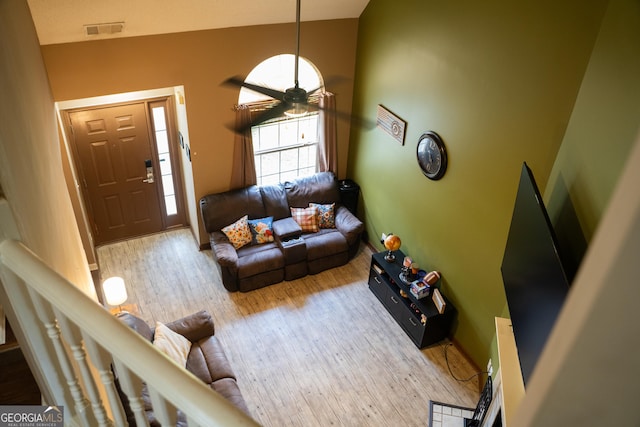 3269 N Winds Trl, Douglasville, GA 30135 - living area with wood finished floors, vaulted ceiling, a ceiling fan, and baseboards