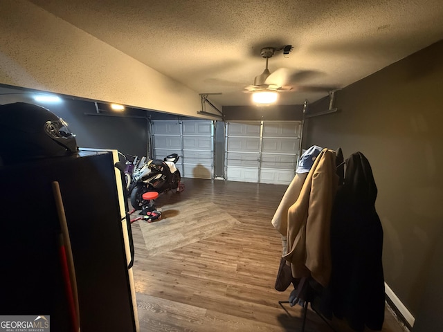 3269 N Winds Trl, Douglasville, GA 30135 - garage with a ceiling fan and freestanding refrigerator