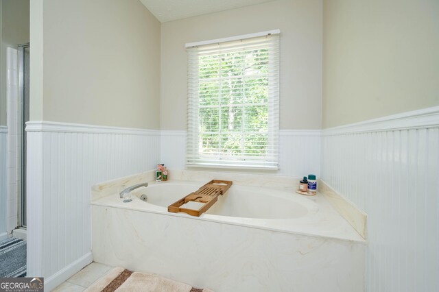 1885 N Creek Cir, Alpharetta, GA 30009 - full bathroom with wainscoting, a bath, healthy amount of natural light, and tile patterned flooring