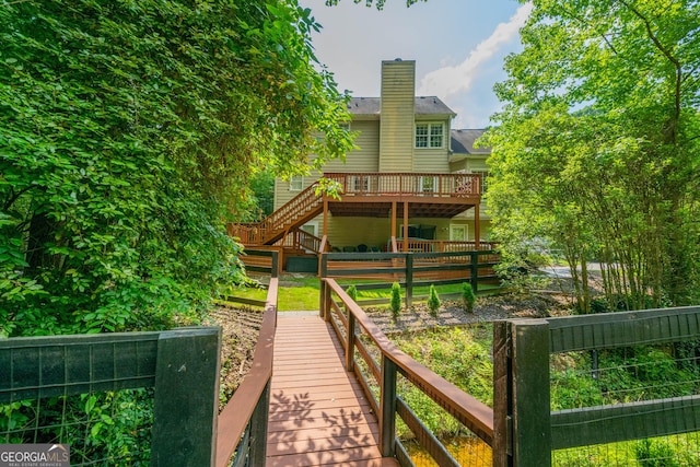 1885 N Creek Cir, Alpharetta, GA 30009 - back of property featuring a deck, stairs, and a chimney