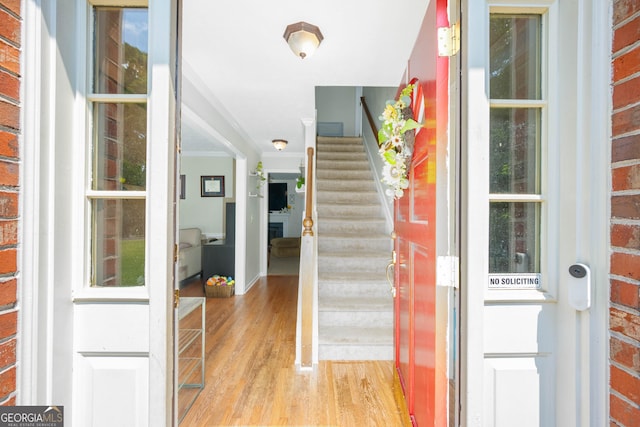 1885 N Creek Cir, Alpharetta, GA 30009 - entrance foyer with light wood-type flooring, ornamental molding, and stairs