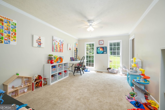 1885 N Creek Cir, Alpharetta, GA 30009 - recreation room featuring ceiling fan, ornamental molding, carpet floors, a textured ceiling, and baseboards