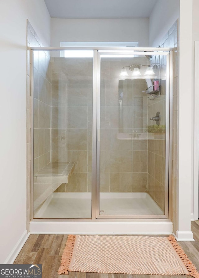 1279 Day Dr, Bogart, GA 30622 - full bath featuring a stall shower, baseboards, and wood finished floors