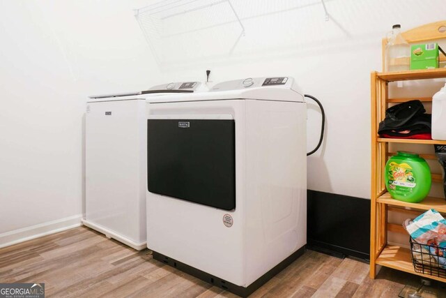 1279 Day Dr, Bogart, GA 30622 - washroom with light wood-type flooring and washer and dryer
