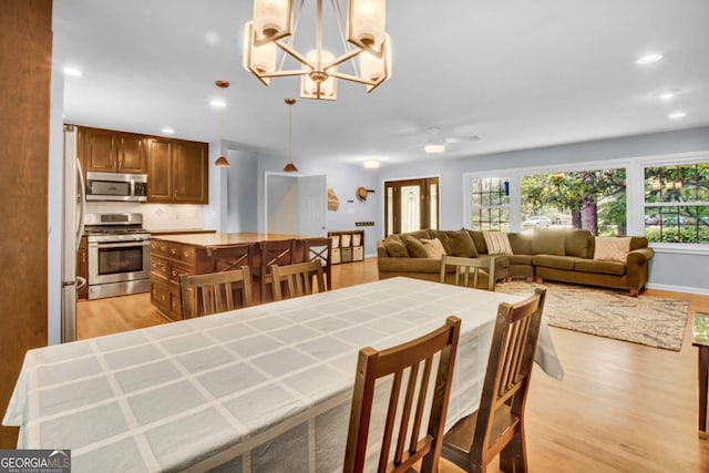 4794 Glenbonnie Ct, Dunwoody, GA 30360 - dining room with plenty of natural light, light wood-type flooring, a chandelier, recessed lighting, and ceiling fan