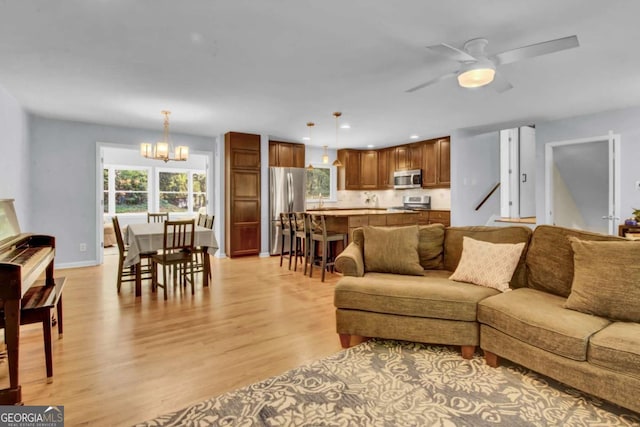4794 Glenbonnie Ct, Dunwoody, GA 30360 - living room with light wood-style floors, a chandelier, a ceiling fan, and recessed lighting