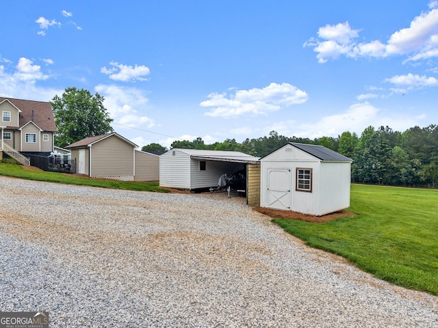 8958 Bill Savage Rd, Lula, GA 30554 - view of shed featuring a detached carport and gravel driveway