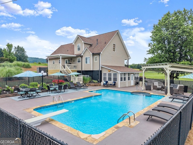 8958 Bill Savage Rd, Lula, GA 30554 - view of pool featuring a pergola, a diving board, a patio, and an outdoor living space