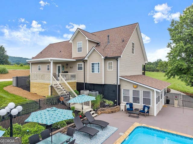 8958 Bill Savage Rd, Lula, GA 30554 - rear view of house with a patio, a fenced backyard, a shingled roof, stairs, and a gate