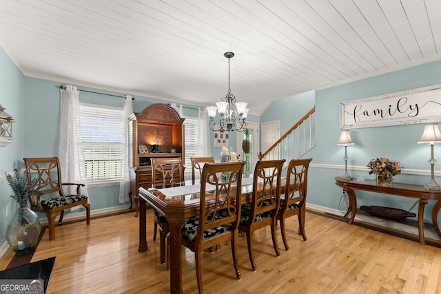 8958 Bill Savage Rd, Lula, GA 30554 - dining area with a chandelier, ornamental molding, light wood finished floors, stairs, and baseboards