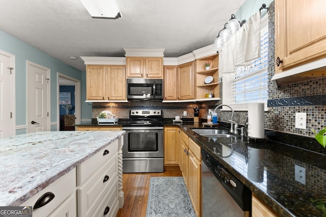 8958 Bill Savage Rd, Lula, GA 30554 - kitchen featuring stainless steel appliances, a sink, light wood-style flooring, open shelves, and dark stone countertops