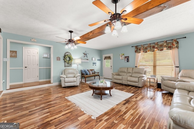 8958 Bill Savage Rd, Lula, GA 30554 - living area featuring ceiling fan, wood finished floors, baseboards, and a textured ceiling