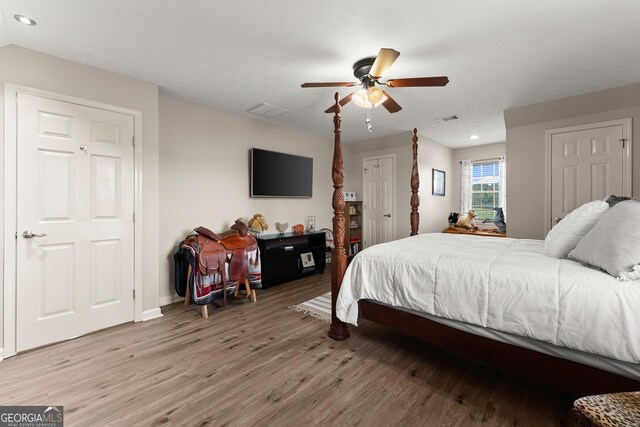 8958 Bill Savage Rd, Lula, GA 30554 - bedroom featuring light wood-type flooring, recessed lighting, a ceiling fan, and baseboards