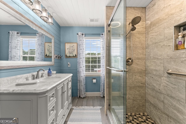 8958 Bill Savage Rd, Lula, GA 30554 - full bath with a tile shower, vanity, and wood finished floors