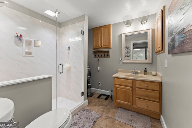 8958 Bill Savage Rd, Lula, GA 30554 - bathroom with toilet, vanity, a marble finish shower, baseboards, and tile patterned floors