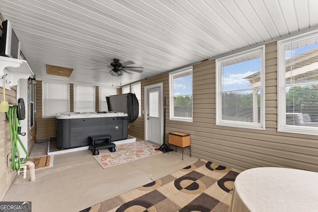 8958 Bill Savage Rd, Lula, GA 30554 - sunroom featuring a ceiling fan and a hot tub