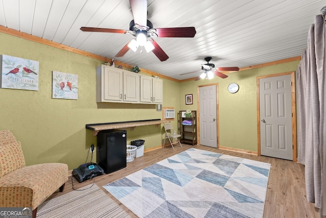 8958 Bill Savage Rd, Lula, GA 30554 - sitting room with ceiling fan, light wood-style floors, a textured wall, a wall mounted air conditioner, and baseboards