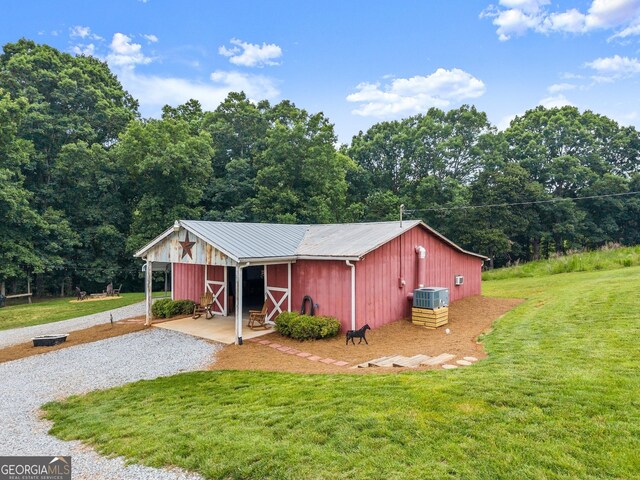8958 Bill Savage Rd, Lula, GA 30554 - view of pole building with a yard and cooling unit