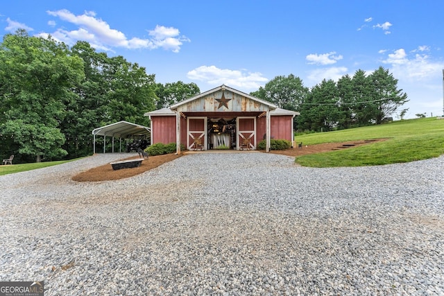 8958 Bill Savage Rd, Lula, GA 30554 - view of front of property featuring gravel driveway, a carport, an outdoor structure, and a front yard