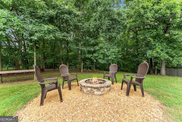 8958 Bill Savage Rd, Lula, GA 30554 - view of green lawn with an outdoor fire pit
