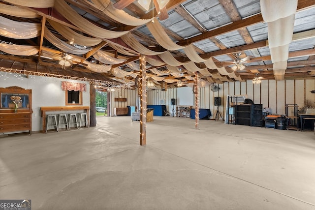 8958 Bill Savage Rd, Lula, GA 30554 - miscellaneous room with ceiling fan and concrete floors