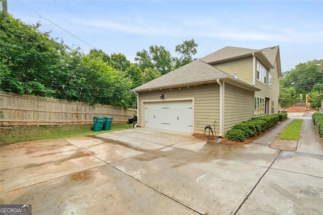 1184 Medlin St SE, Smyrna, GA 30080 - view of property exterior with concrete driveway and an attached garage