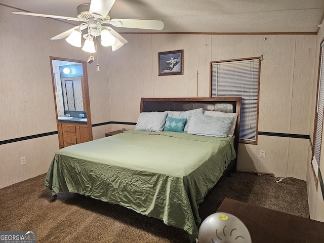 136 Hickory Hl, Anniston, AL 36206 - carpeted bedroom featuring ornamental molding, a ceiling fan, and wood walls