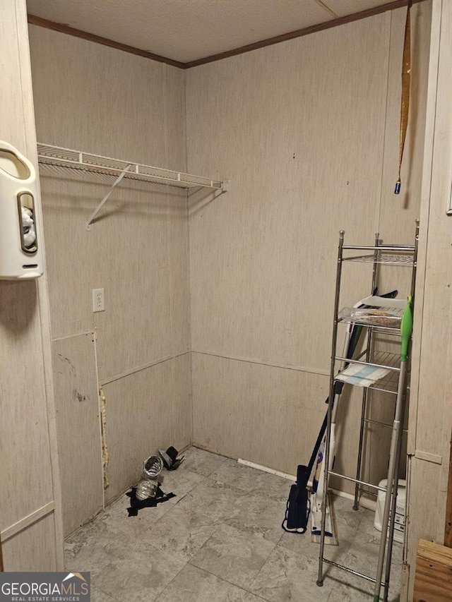 136 Hickory Hl, Anniston, AL 36206 - laundry room with crown molding and wooden walls