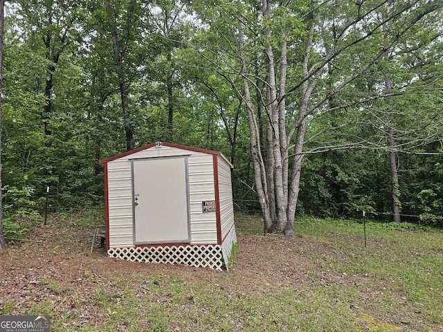 136 Hickory Hl, Anniston, AL 36206 - view of shed featuring a view of trees