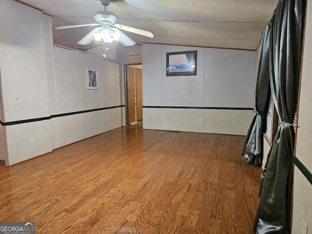 136 Hickory Hl, Anniston, AL 36206 - unfurnished room with wood finished floors, ceiling fan, and lofted ceiling