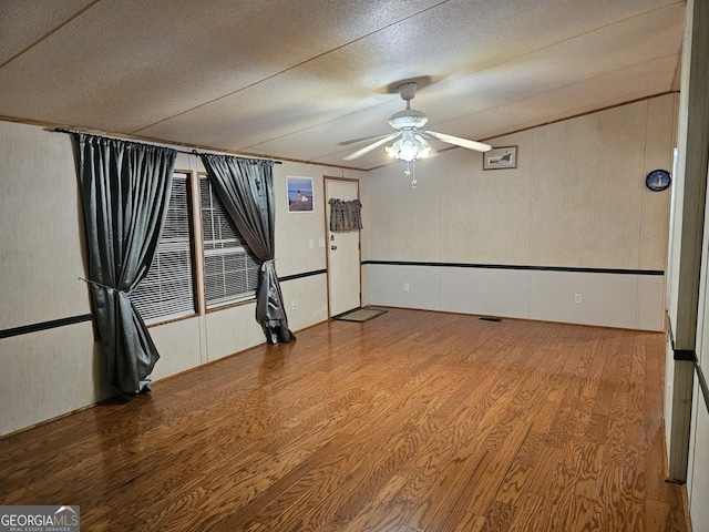 136 Hickory Hl, Anniston, AL 36206 - empty room featuring ceiling fan, wood finished floors, and a textured ceiling