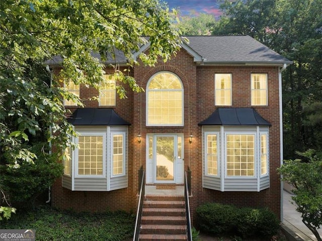 1625 Clark Lake Dr NW, Acworth, GA 30102 - traditional home featuring brick siding, a standing seam roof, and metal roof