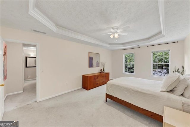 1625 Clark Lake Dr NW, Acworth, GA 30102 - bedroom featuring a tray ceiling, a textured ceiling, light colored carpet, baseboards, and ornamental molding