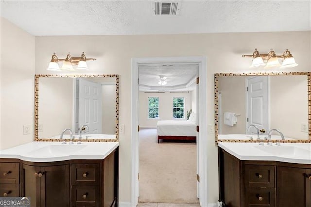 1625 Clark Lake Dr NW, Acworth, GA 30102 - bathroom with two vanities, ensuite bath, a textured ceiling, and baseboards